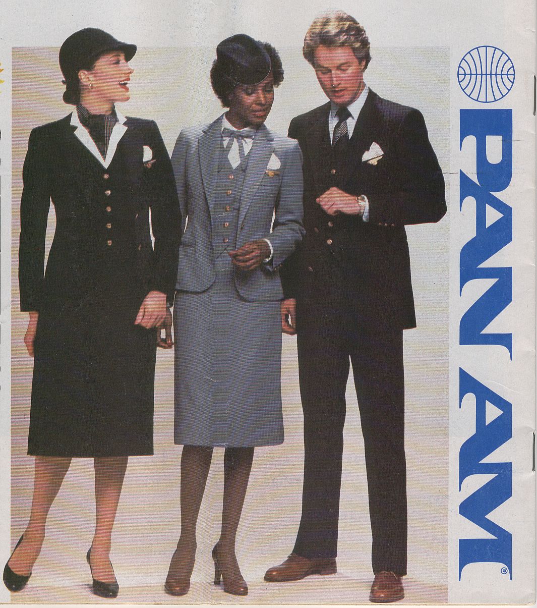 In July of 1980 Pan Am introduced new flight attendant uniforms designed fy popular 1980s designer Adolfo.  The uniform came in both navy & powder blue.  The uniform would be modified in the late 1980s with different blouses, ties, scarves and aprons.  At that time the powder blue option was discontinued.